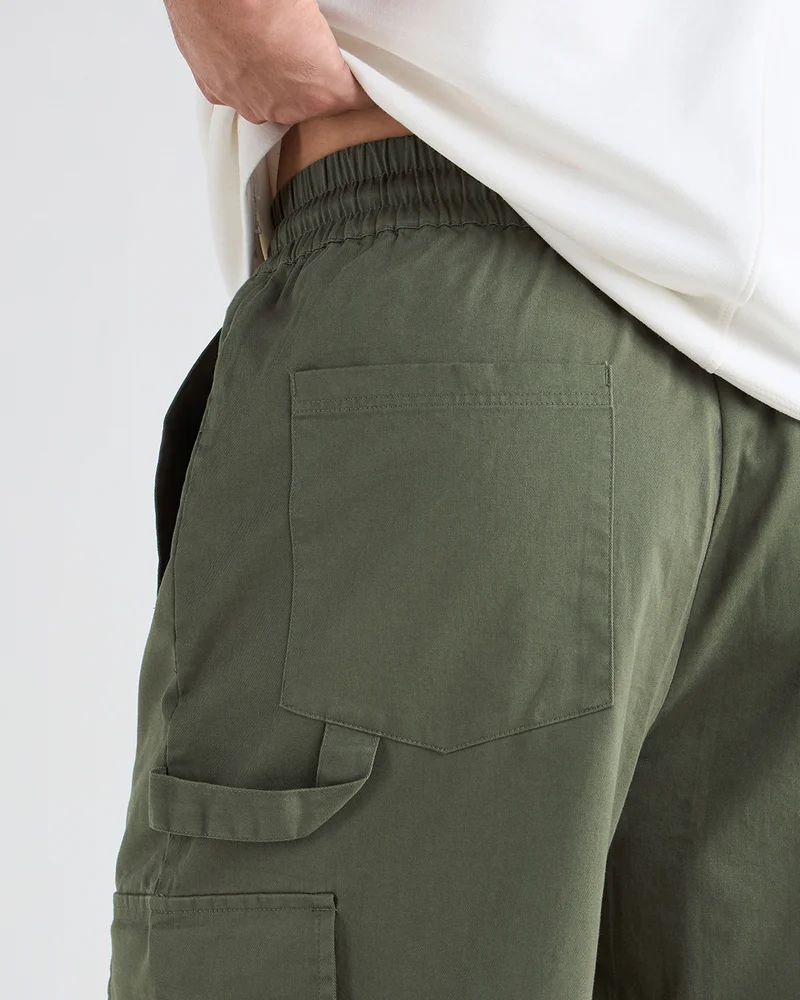 Bewakoof  Men's Dusty Olive Green Oversized Cargo Carpenter Pants for Men | Best Price UAE